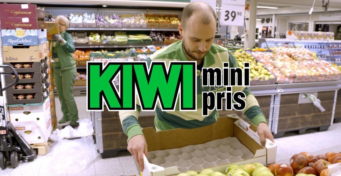 KIWI store employee replenishing fresh produce using goods delivered on SpaceInvader racks, improving ergonomics and in-store efficiency.