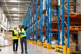 Warehouse illustration with performance charts and ROI formula, showing how to measure the return on investment of logistics efficiency.